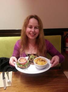 Dani with her Papa's Portobello Sandwich & Vegan Mac & Cheese